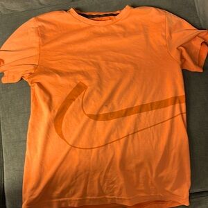 Orange Nike DRI-FIT shirt
